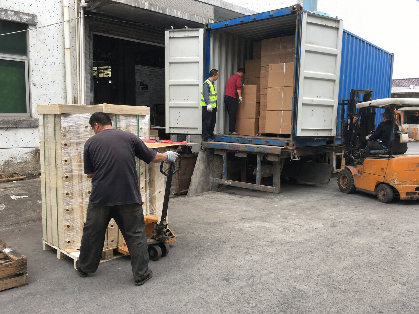 Export cartons being loaded into a shipping container